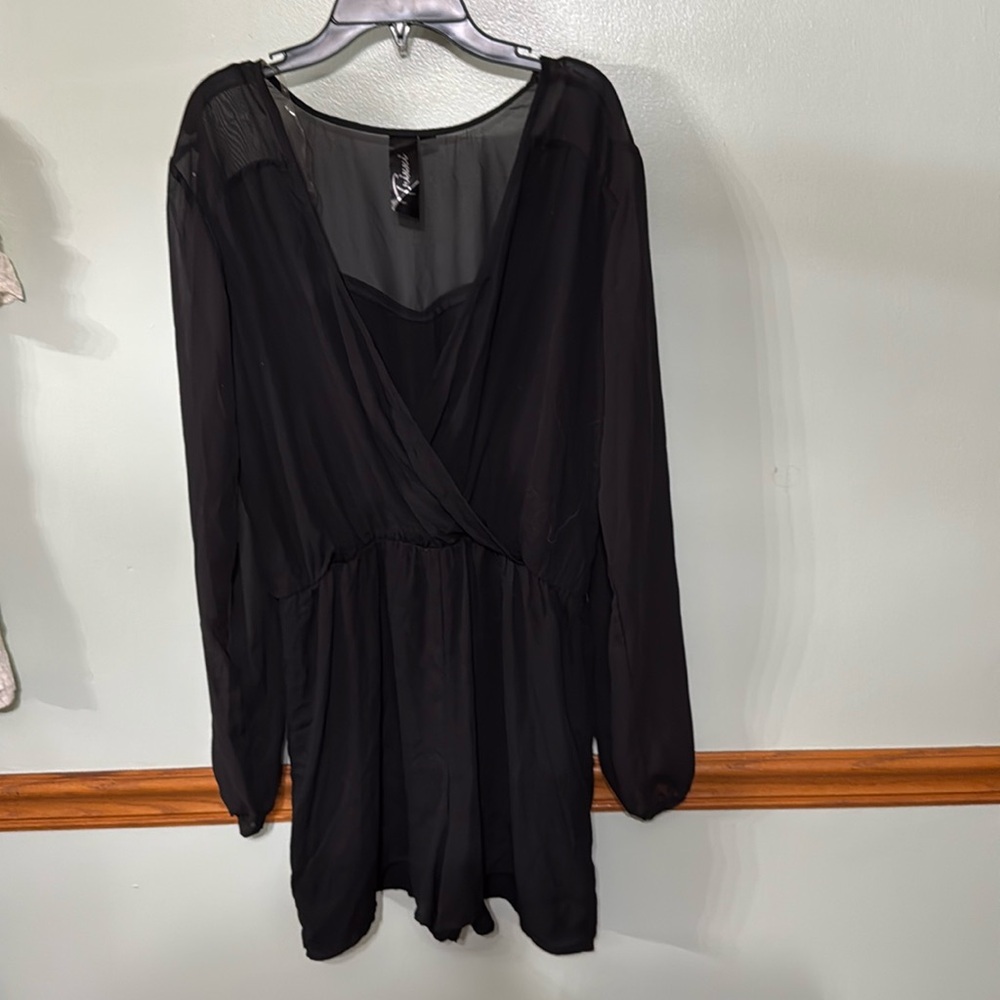 Trixxi black sheer sleeve romper. Size: Medium. Shorts with V neck top.